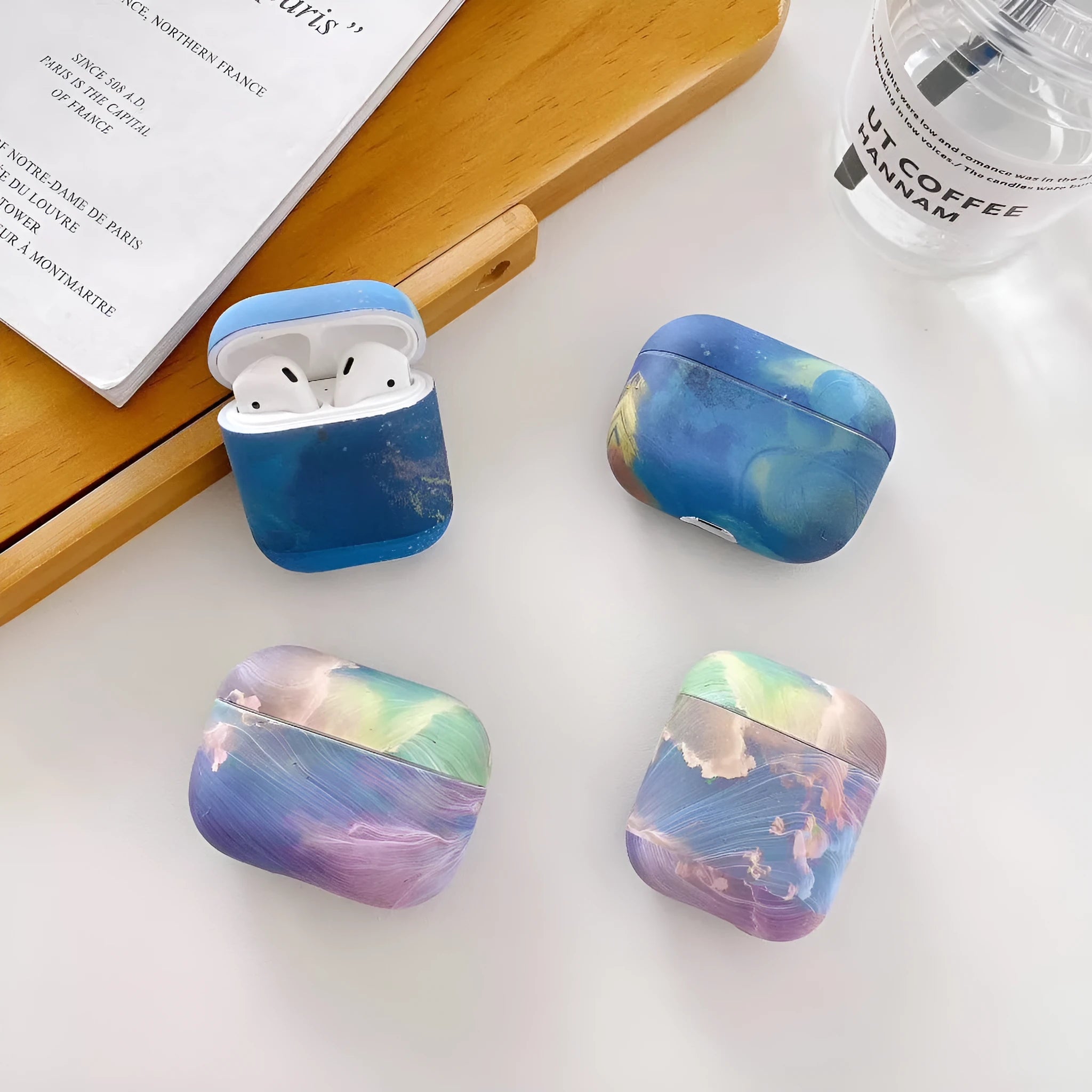 Pink and blue watercolour plastic protective sleeve for Apple AirPods 1, 2, and Pro charging cases.