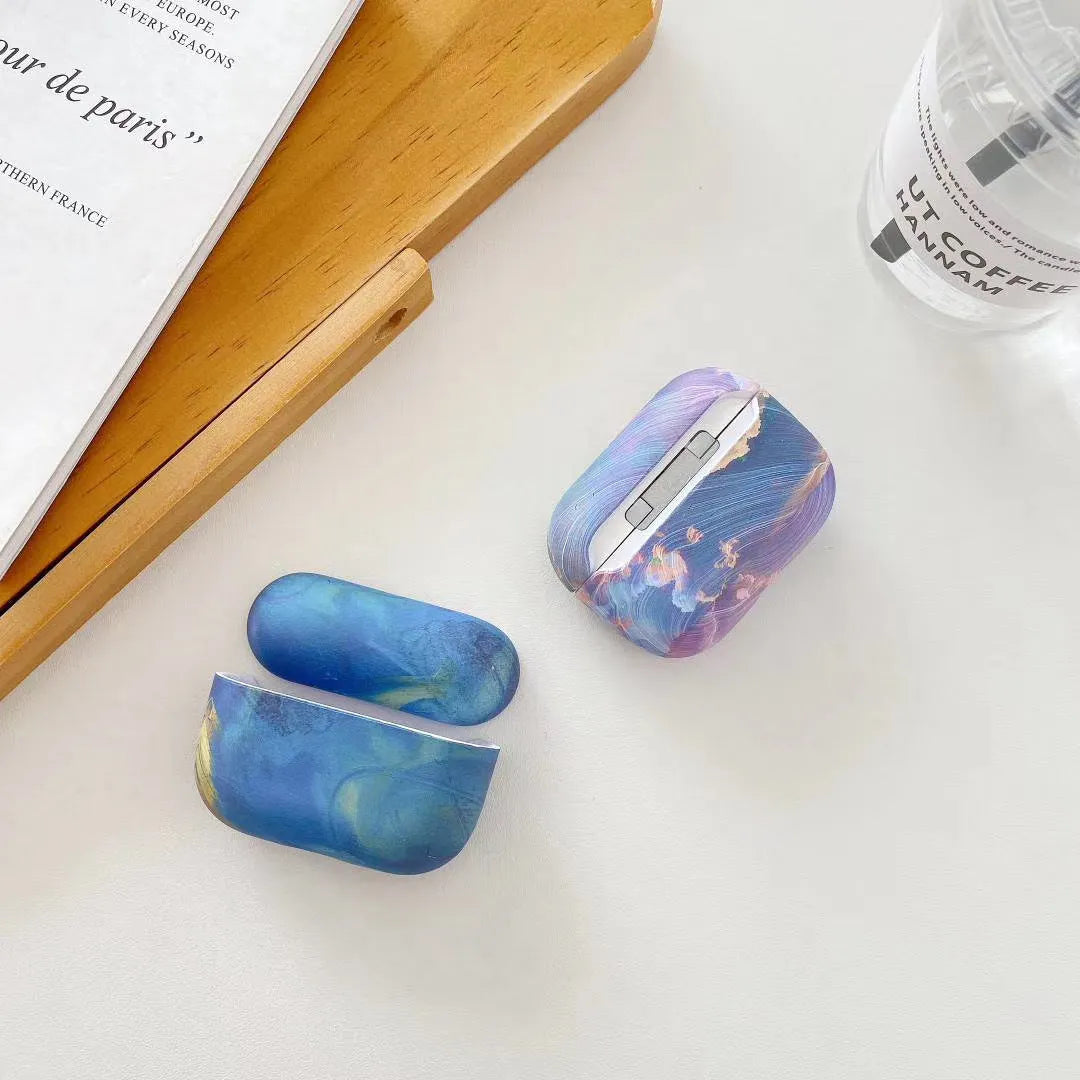 Pink and blue watercolour plastic protective sleeve for Apple AirPods 1, 2, and Pro charging cases.