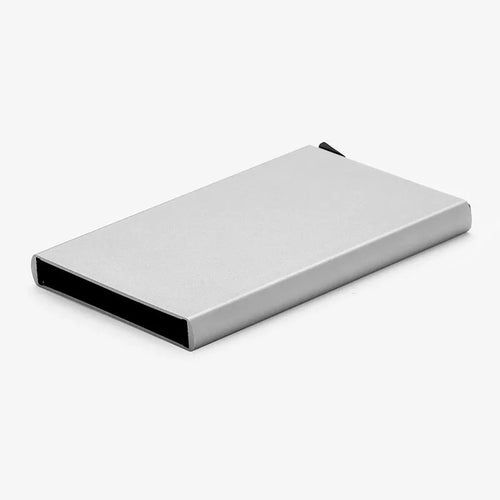 Geometric aluminium business card holder in gold finish displaying business cards