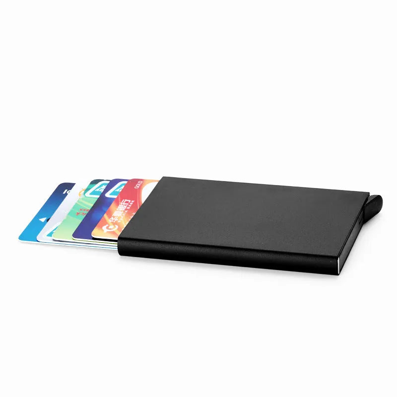 Geometric aluminium business card holder in gold finish displaying business cards