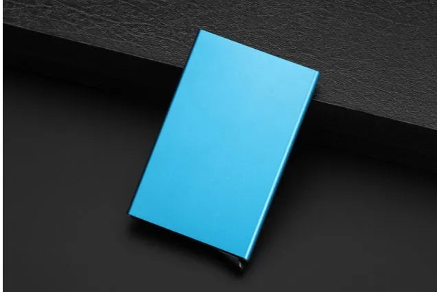 Geometric aluminium business card holder in gold finish displaying business cards
