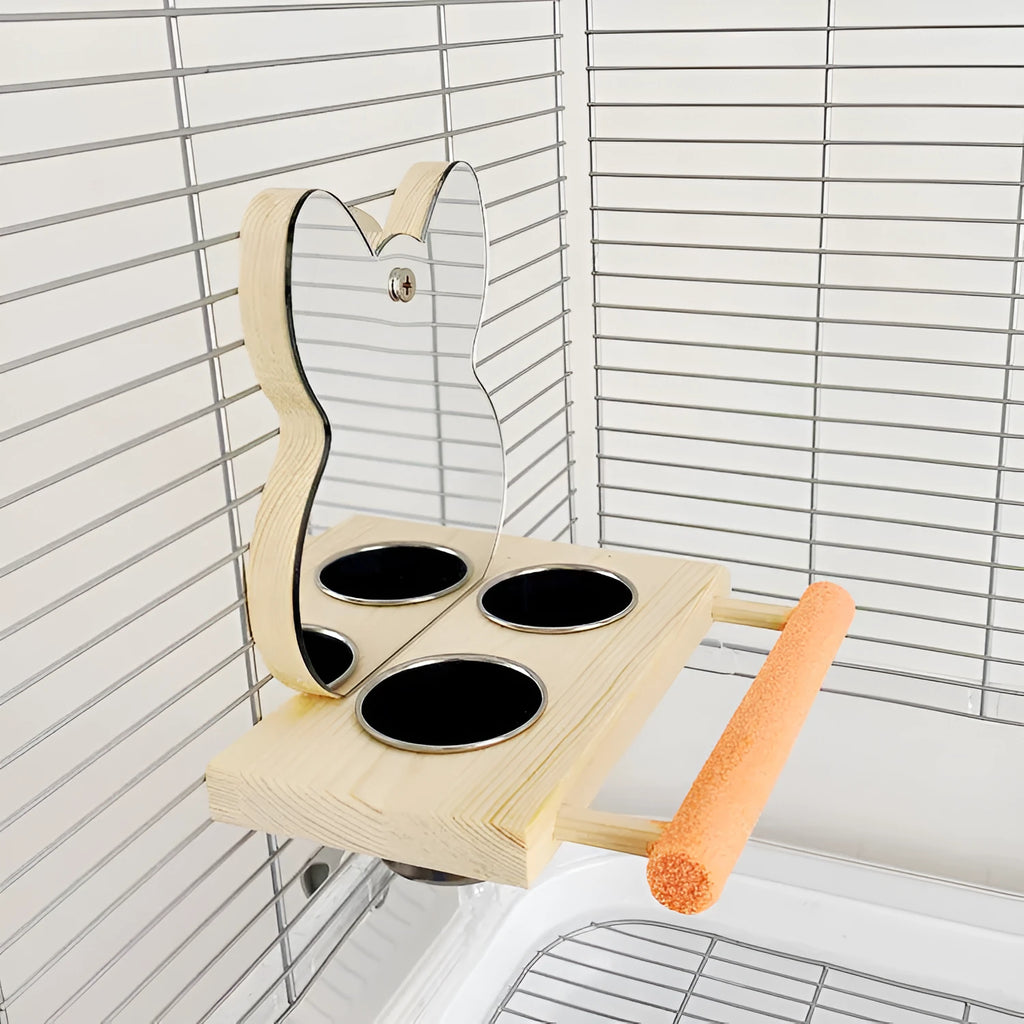 Wood-coloured parrot toy with stainless steel food cup, mirror, and grinding claw perch on a compact stand