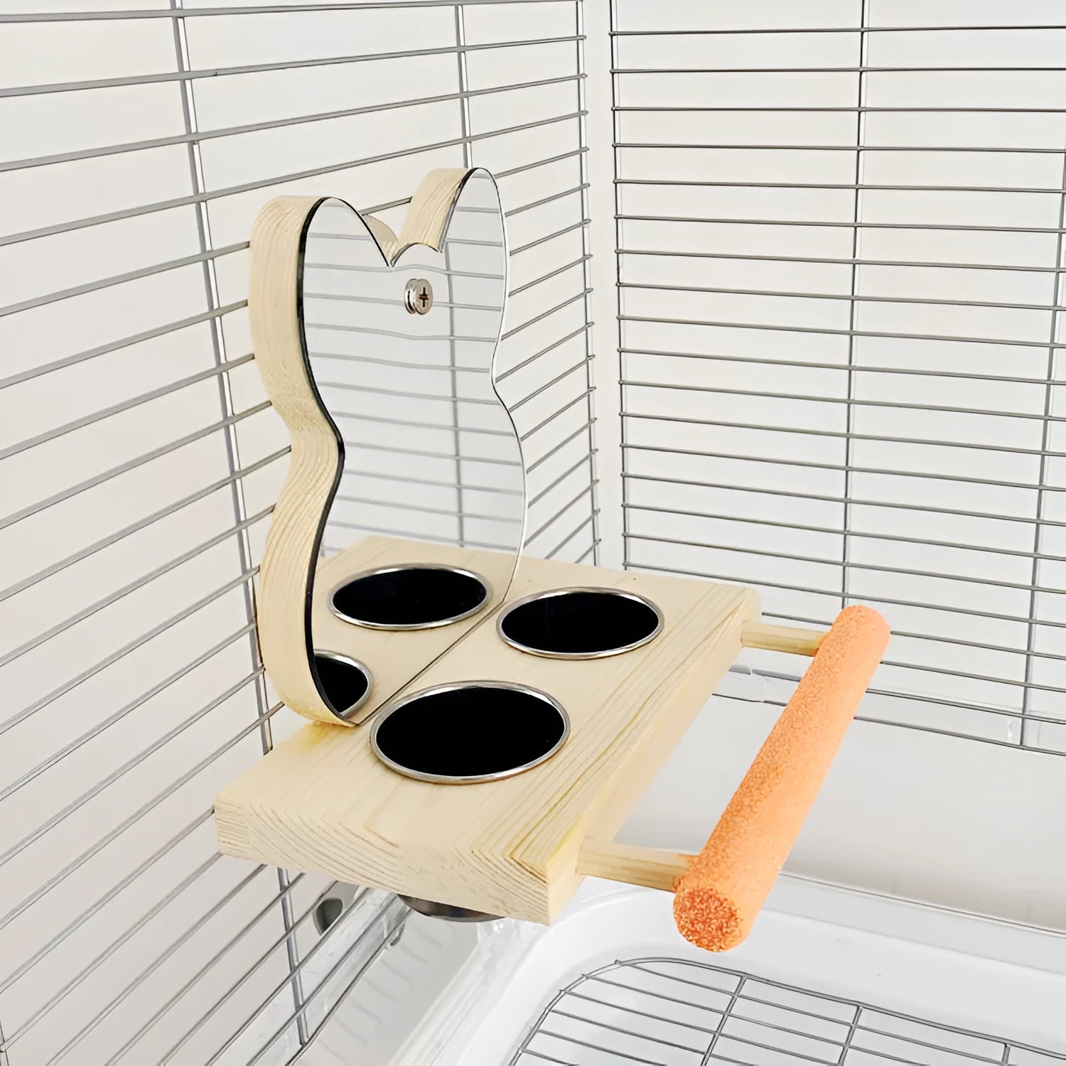 Wood-coloured parrot toy with stainless steel food cup, mirror, and grinding claw perch on a compact stand