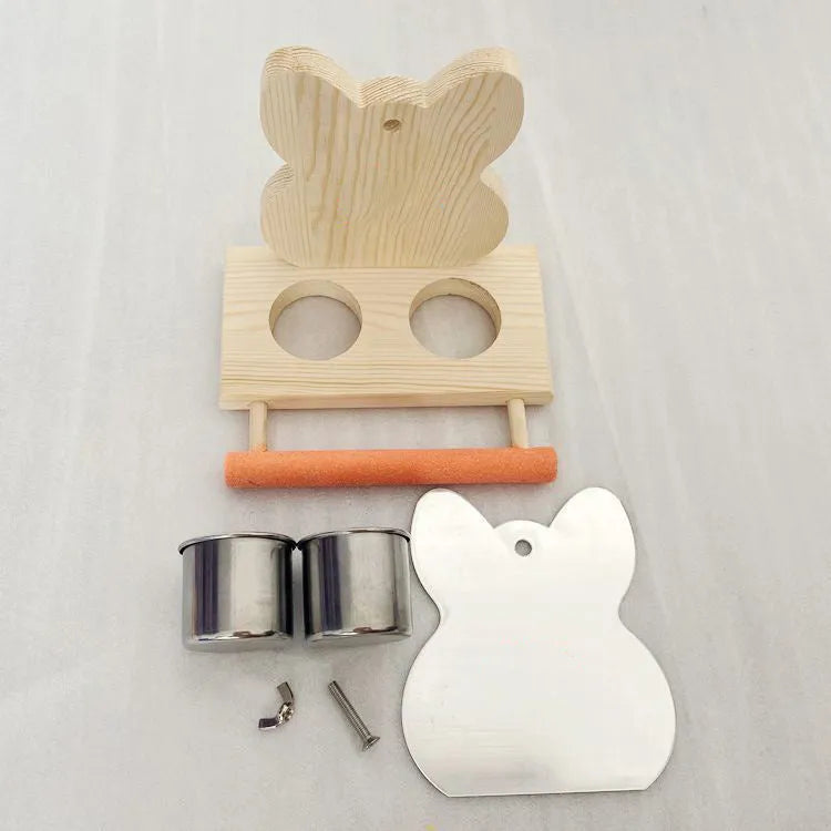 Wood-coloured parrot toy with stainless steel food cup, mirror, and grinding claw perch on a compact stand