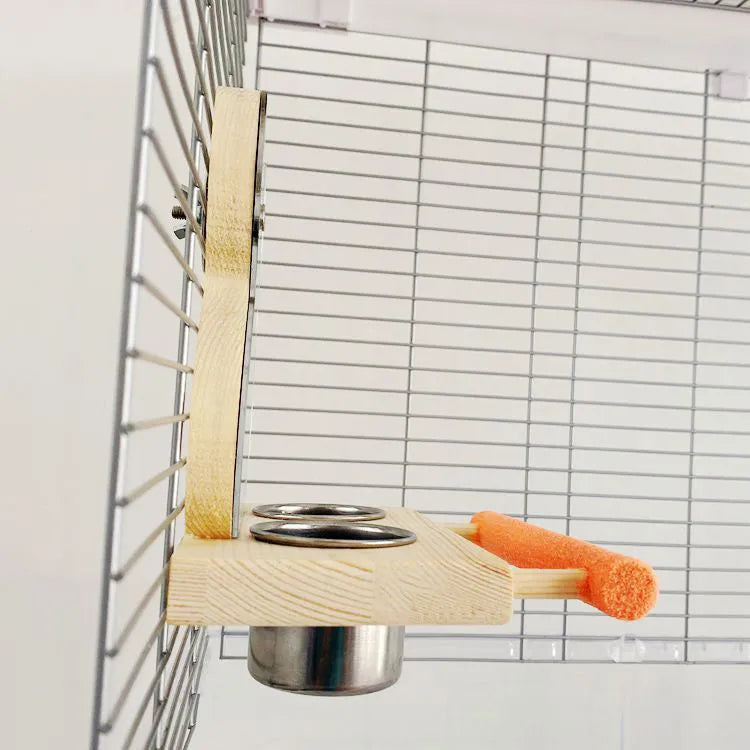 Wood-coloured parrot toy with stainless steel food cup, mirror, and grinding claw perch on a compact stand