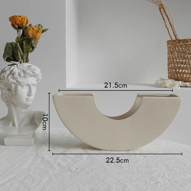 Unglazed matte ceramic vase for dry flower arrangements in Nordic style