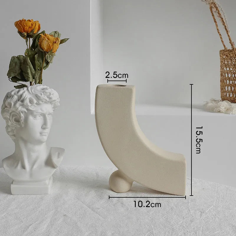 Unglazed matte ceramic vase for dry flower arrangements in Nordic style