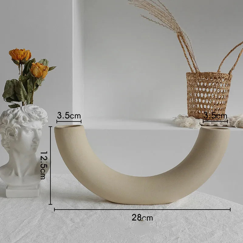 Unglazed matte ceramic vase for dry flower arrangements in Nordic style