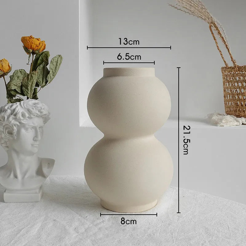 Unglazed matte ceramic vase for dry flower arrangements in Nordic style