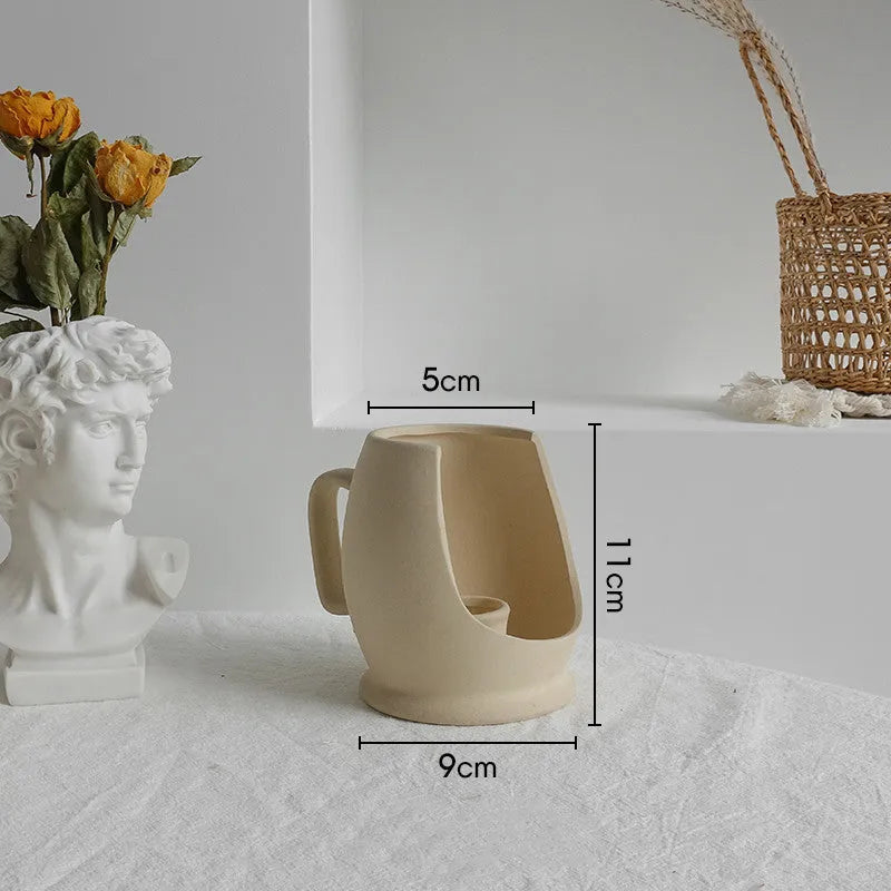 Unglazed matte ceramic vase for dry flower arrangements in Nordic style