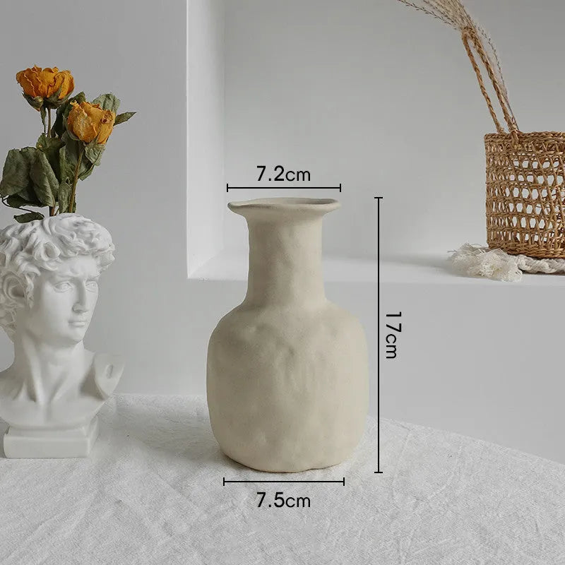 Unglazed matte ceramic vase for dry flower arrangements in Nordic style