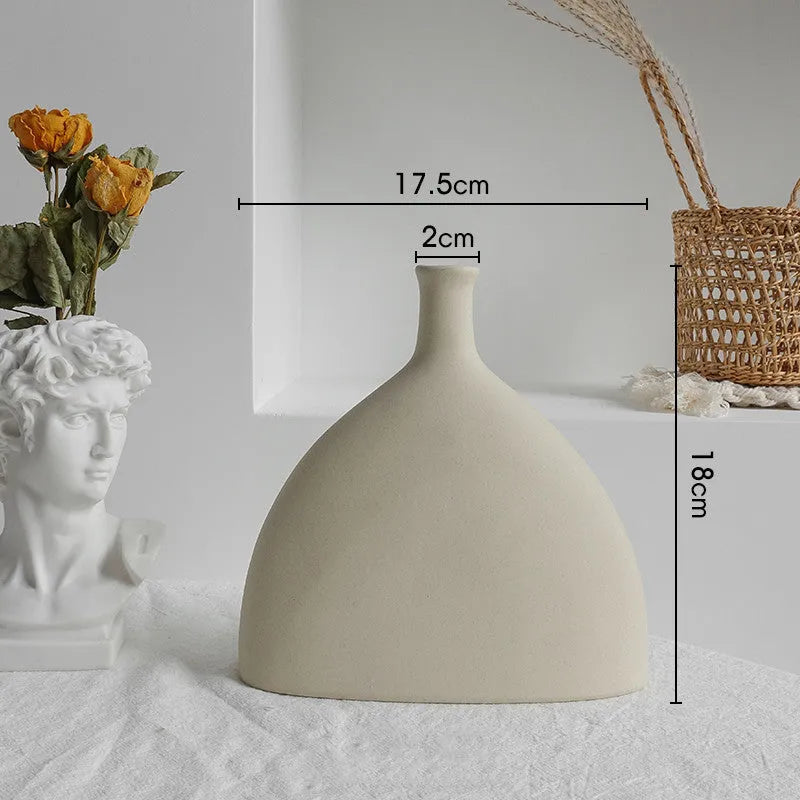 Unglazed matte ceramic vase for dry flower arrangements in Nordic style