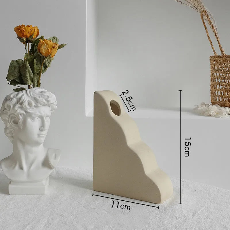 Unglazed matte ceramic vase for dry flower arrangements in Nordic style