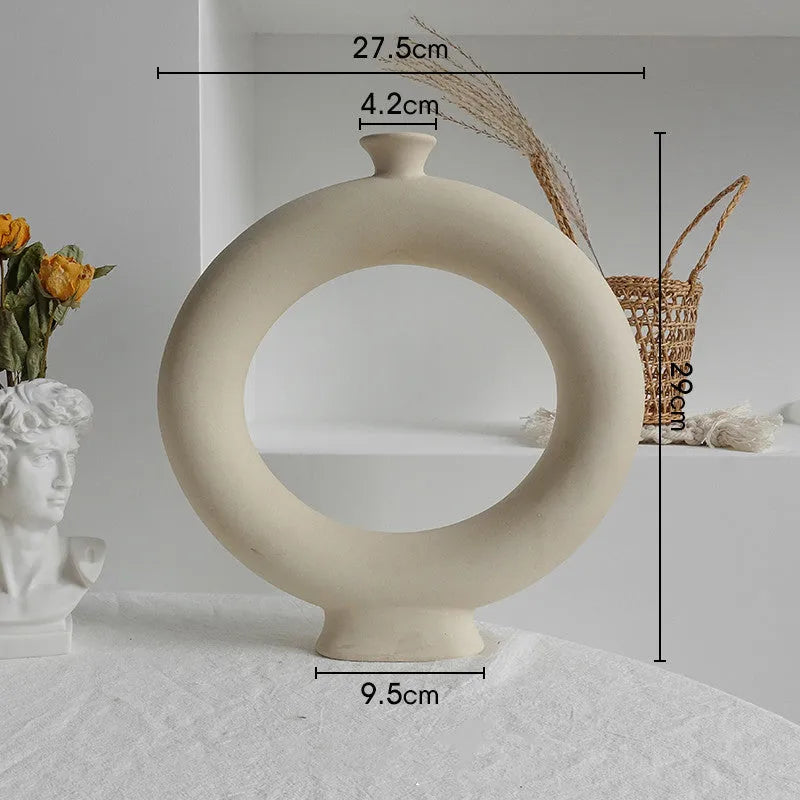 Unglazed matte ceramic vase for dry flower arrangements in Nordic style