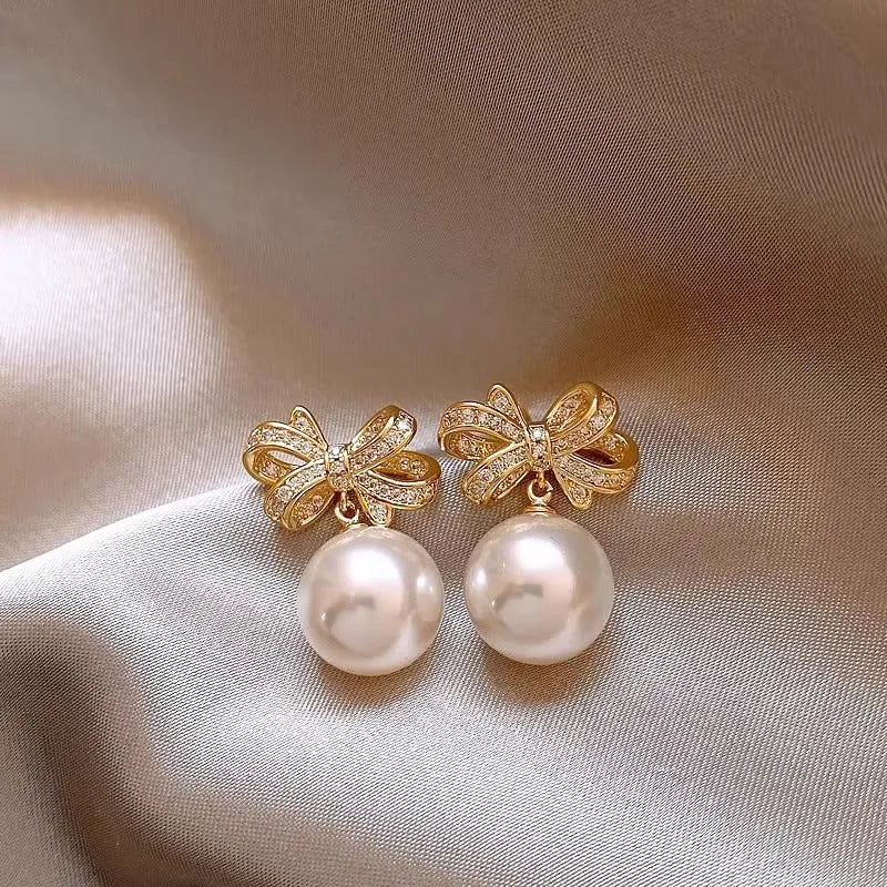 Gold tone bow pearl stud earrings, 12mm alloy women's earrings supplied as one pair