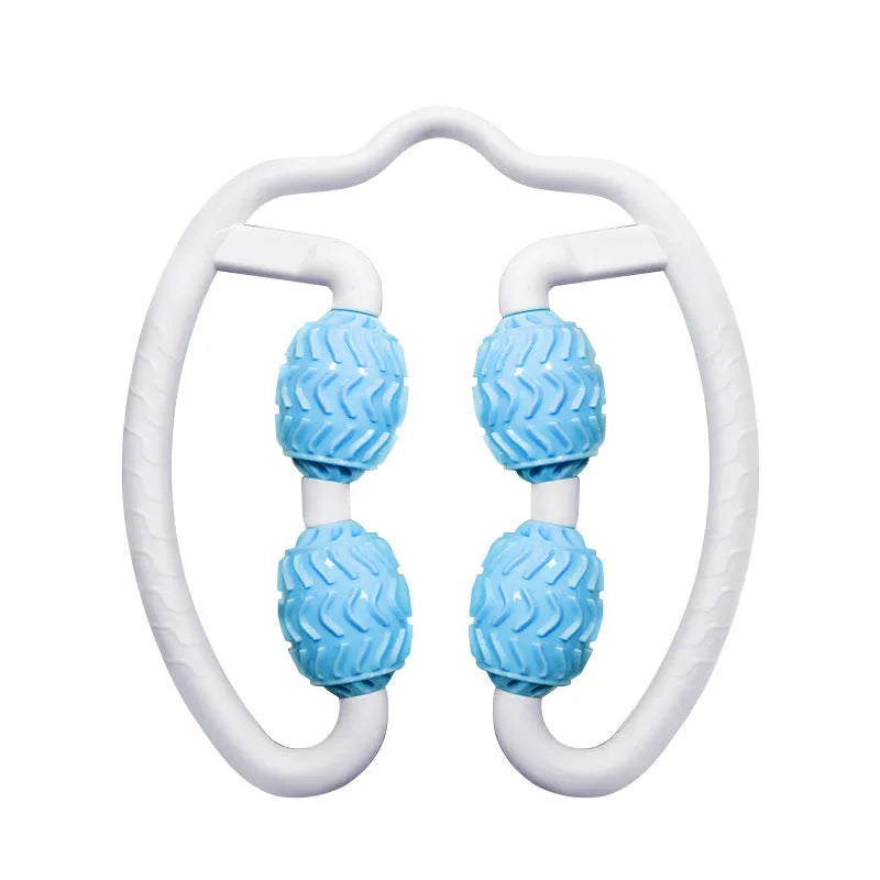 Purple annular silicone leg massage roller on a neutral background.