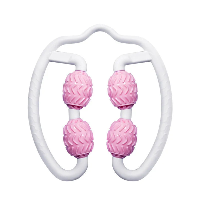 Purple annular silicone leg massage roller on a neutral background.