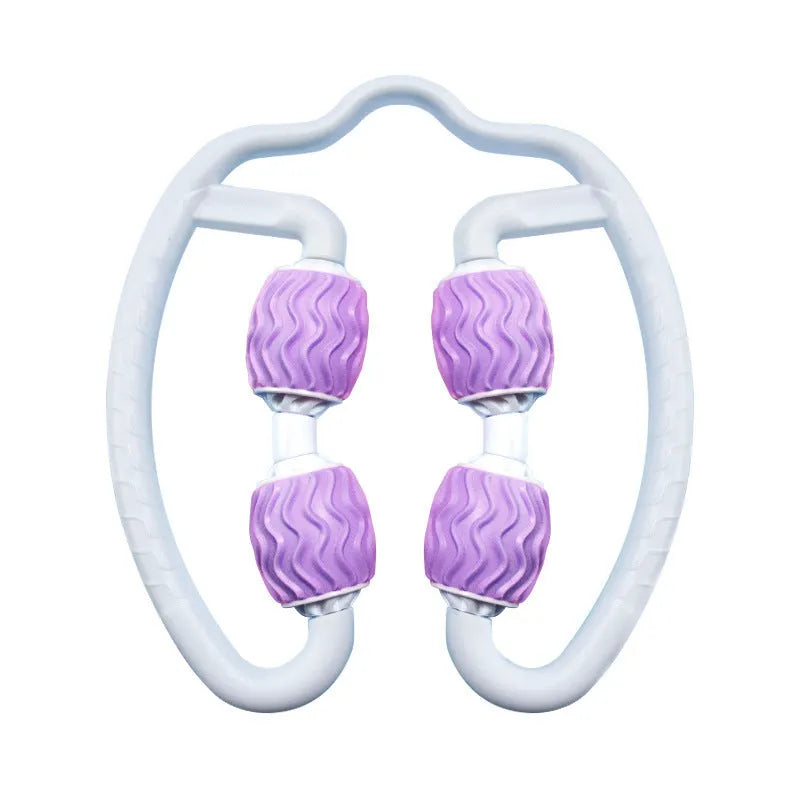 Purple annular silicone leg massage roller on a neutral background.