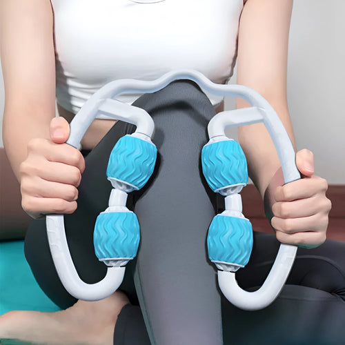 Purple annular silicone leg massage roller on a neutral background.