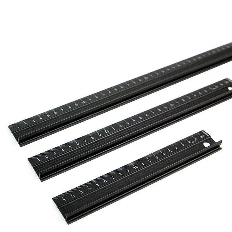 Black aluminium alloy cutting ruler with 12.5mm high protection board and non-slip pad on a cutting mat