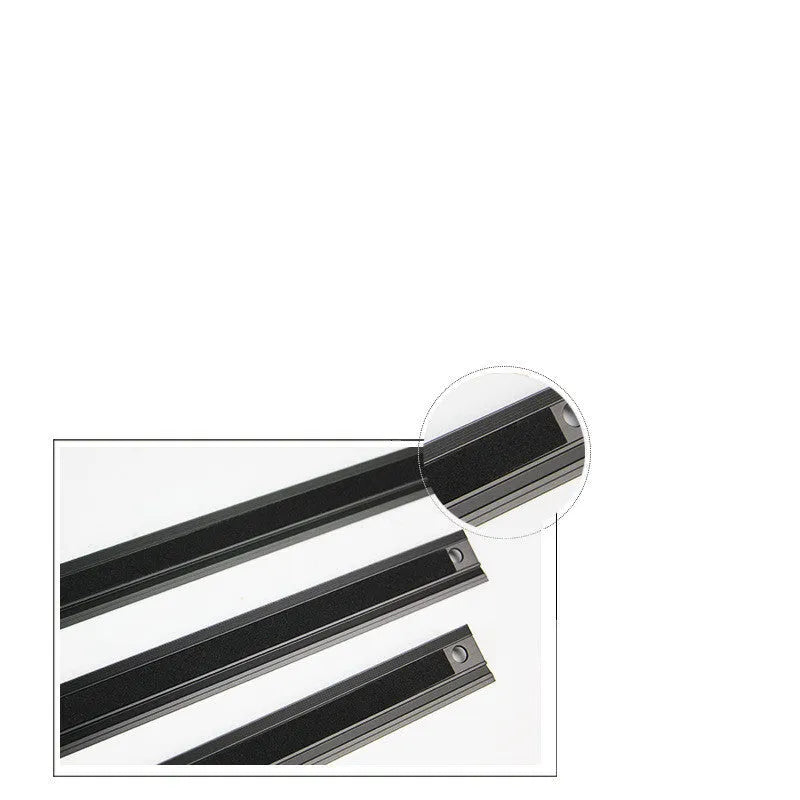 Black aluminium alloy cutting ruler with 12.5mm high protection board and non-slip pad on a cutting mat