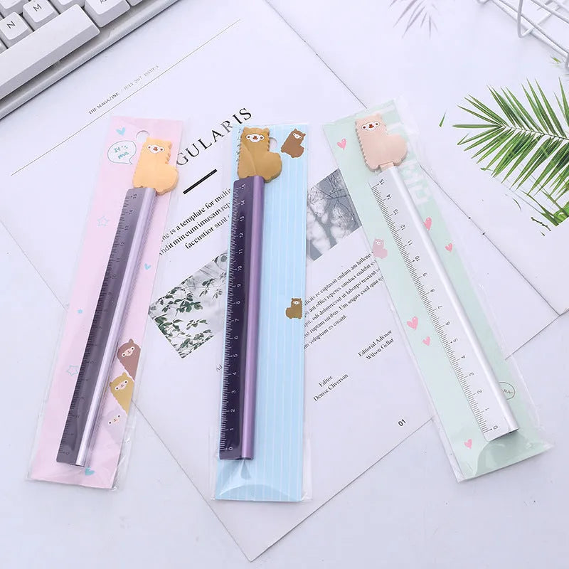 Colourful alpaca design printed on a silver 30 cm aluminium ruler with measurement markings
