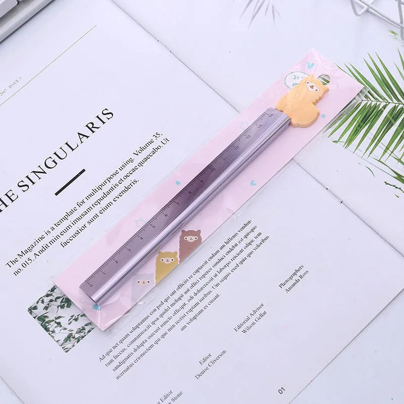 Colourful alpaca design printed on a silver 30 cm aluminium ruler with measurement markings