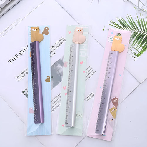 Colourful alpaca design printed on a silver 30 cm aluminium ruler with measurement markings