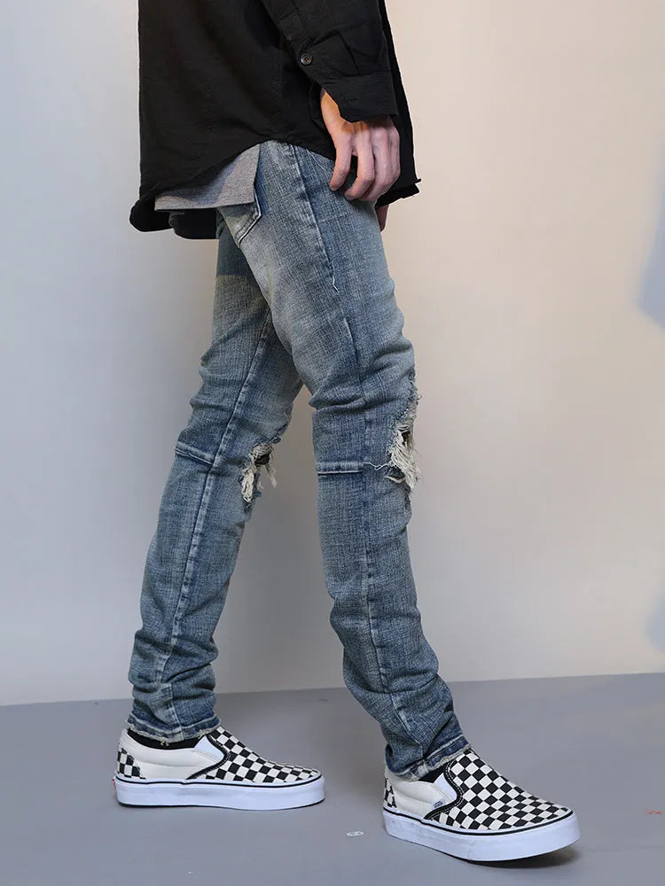 Men's ripped washed blue cotton denim jeans with mid waist and zip fly, sizes M to XXL