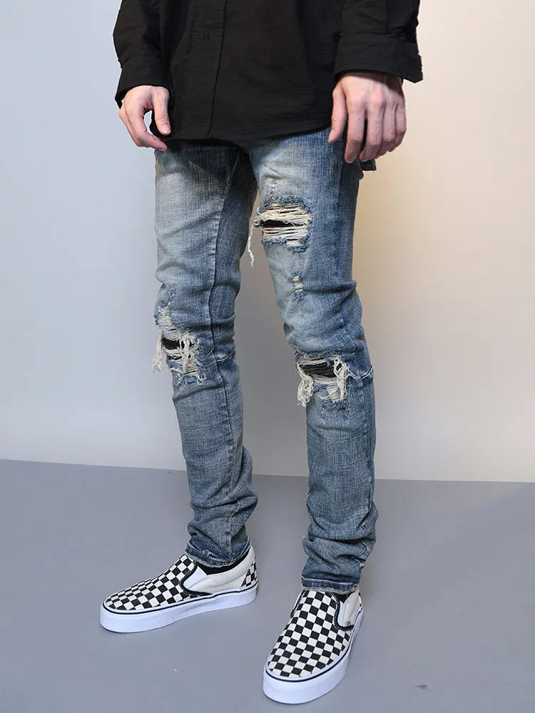 Men's ripped washed blue cotton denim jeans with mid waist and zip fly, sizes M to XXL