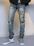Men's ripped washed blue cotton denim jeans with mid waist and zip fly, sizes M to XXL