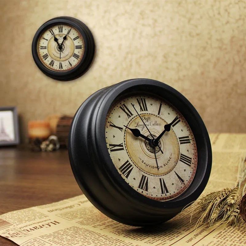 Round retro European-style 6-inch desk alarm clock with a white dial on a wooden surface.