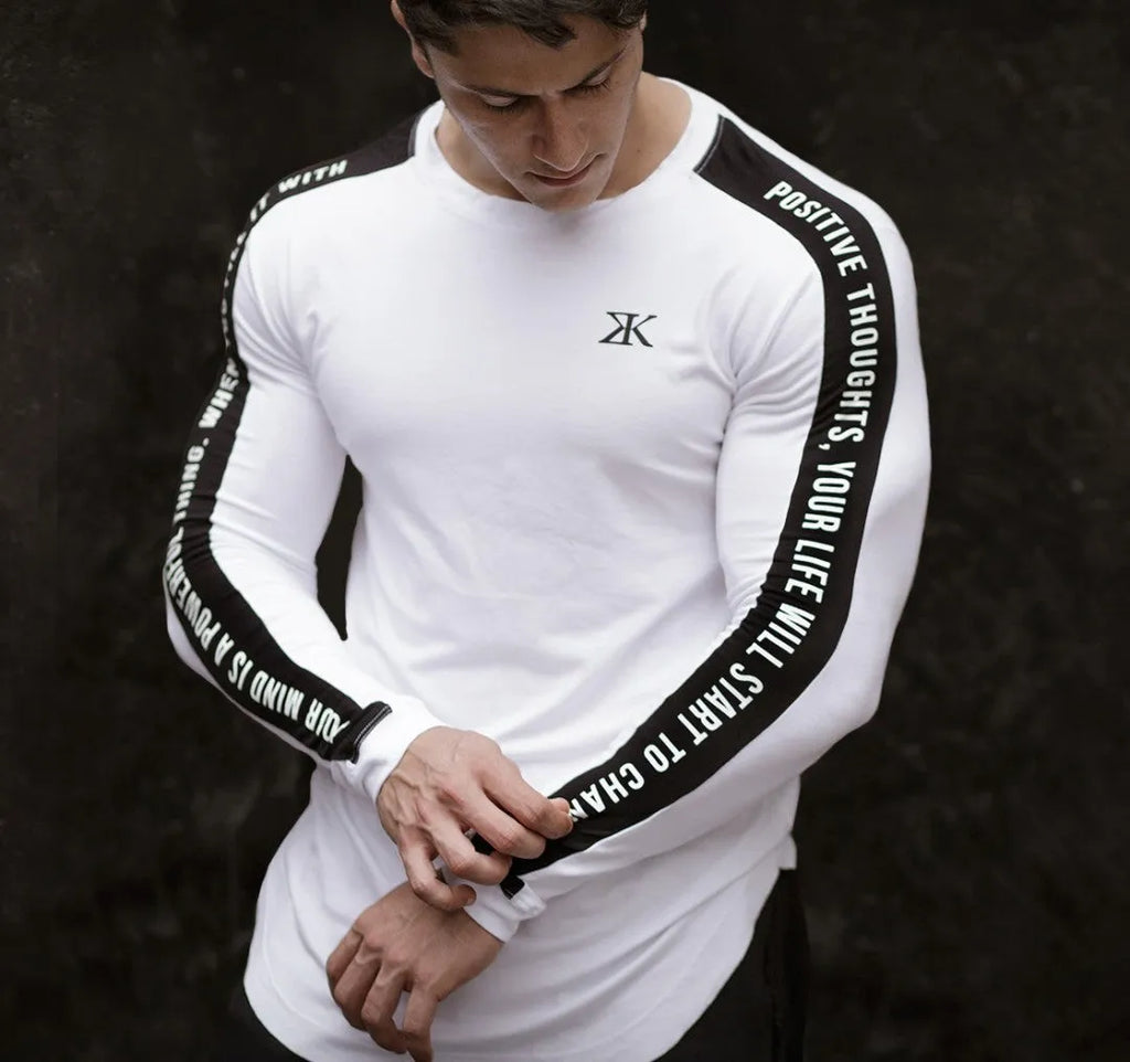 Men's long-sleeved compression top in black, breathable elastic fabric for fitness training