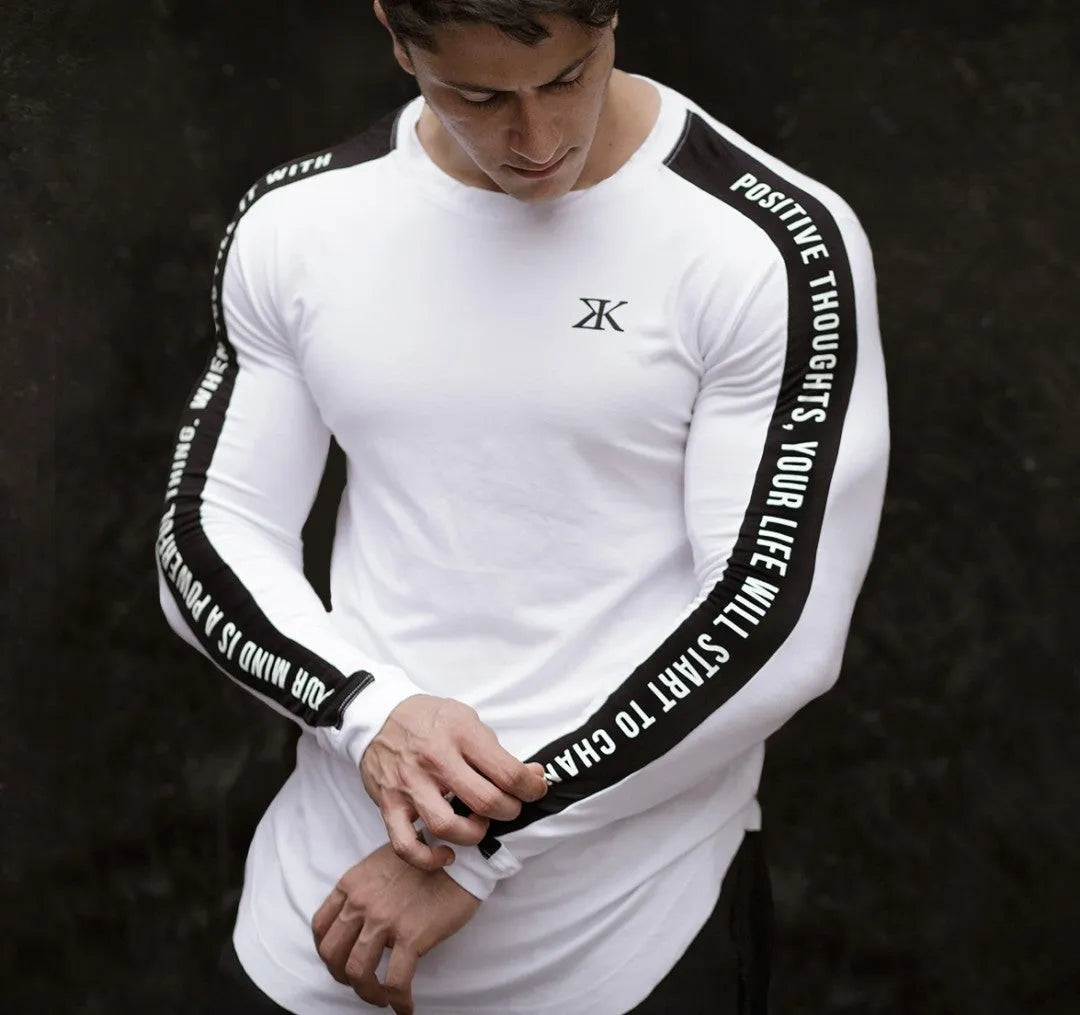 Men's long-sleeved compression top in black, breathable elastic fabric for fitness training