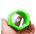 Yellow and green spiral knife vegetable cutter made of plastic on a kitchen worktop.