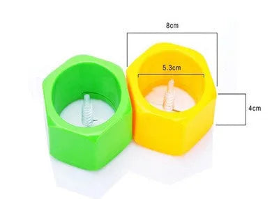 Yellow and green spiral knife vegetable cutter made of plastic on a kitchen worktop.