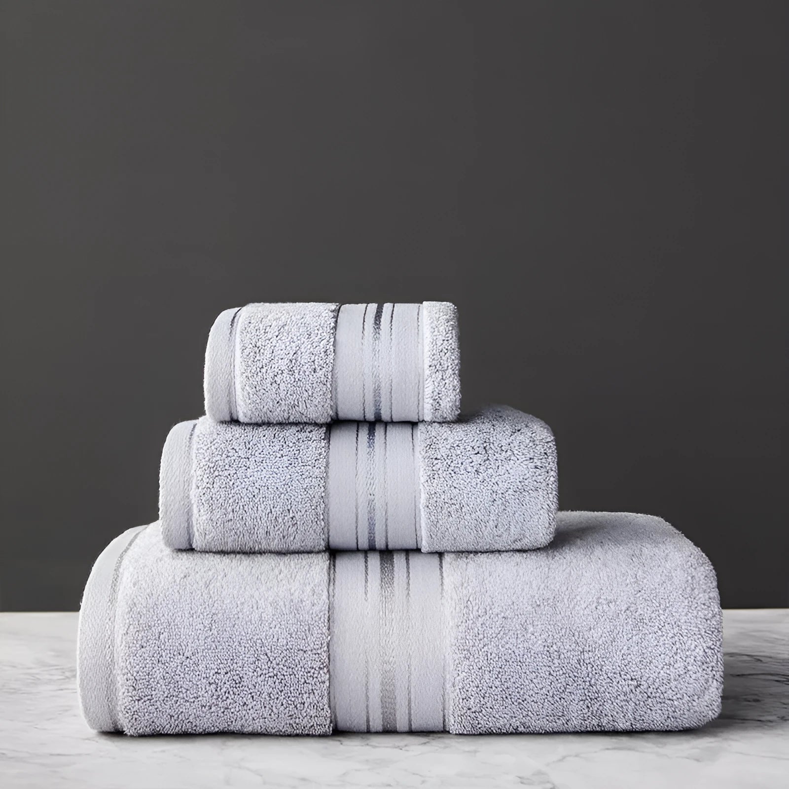 Pure cotton bath towel set showing three pieces in blue colour with floral pattern detail
