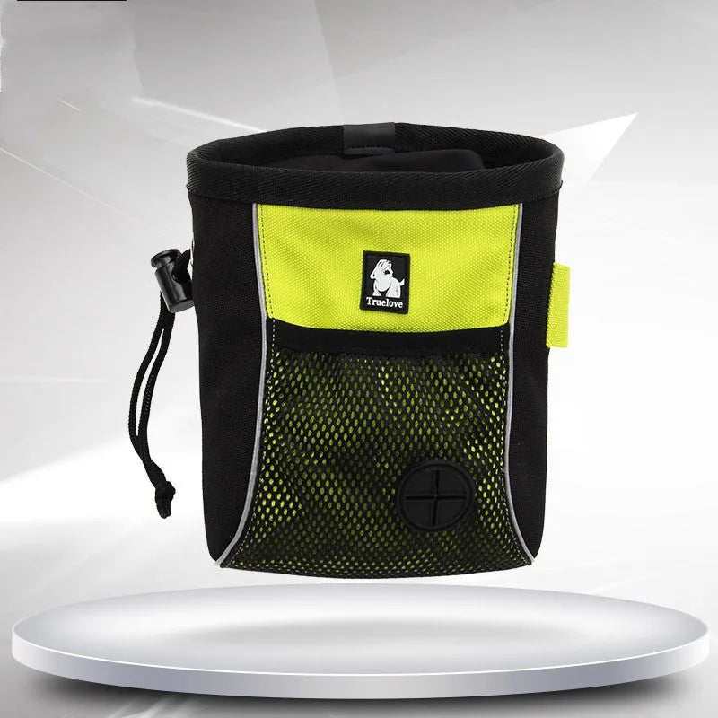 Green dog training waist bag with removable waste pouch, shown on a person's hip.
