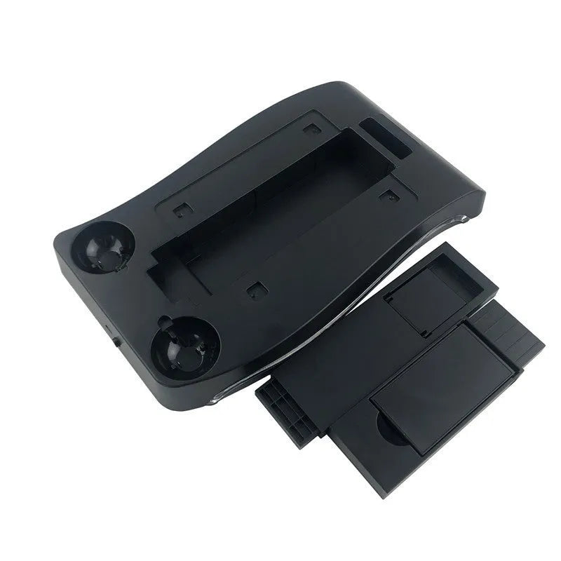 Black PS4 VR controller charging base dock station on a surface.