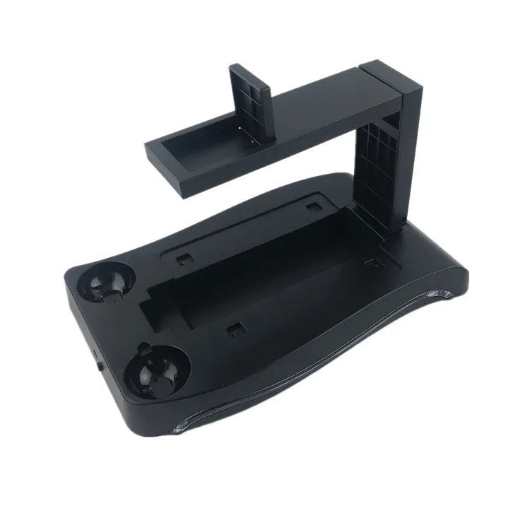 Black PS4 VR controller charging base dock station on a surface.