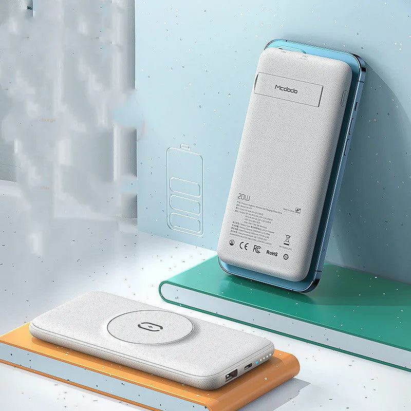 Maiduo mint green Magsafe power bank magnetically attached to an iPhone, showing its slim clip-on design.
