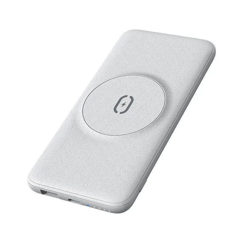 Maiduo mint green Magsafe power bank magnetically attached to an iPhone, showing its slim clip-on design.
