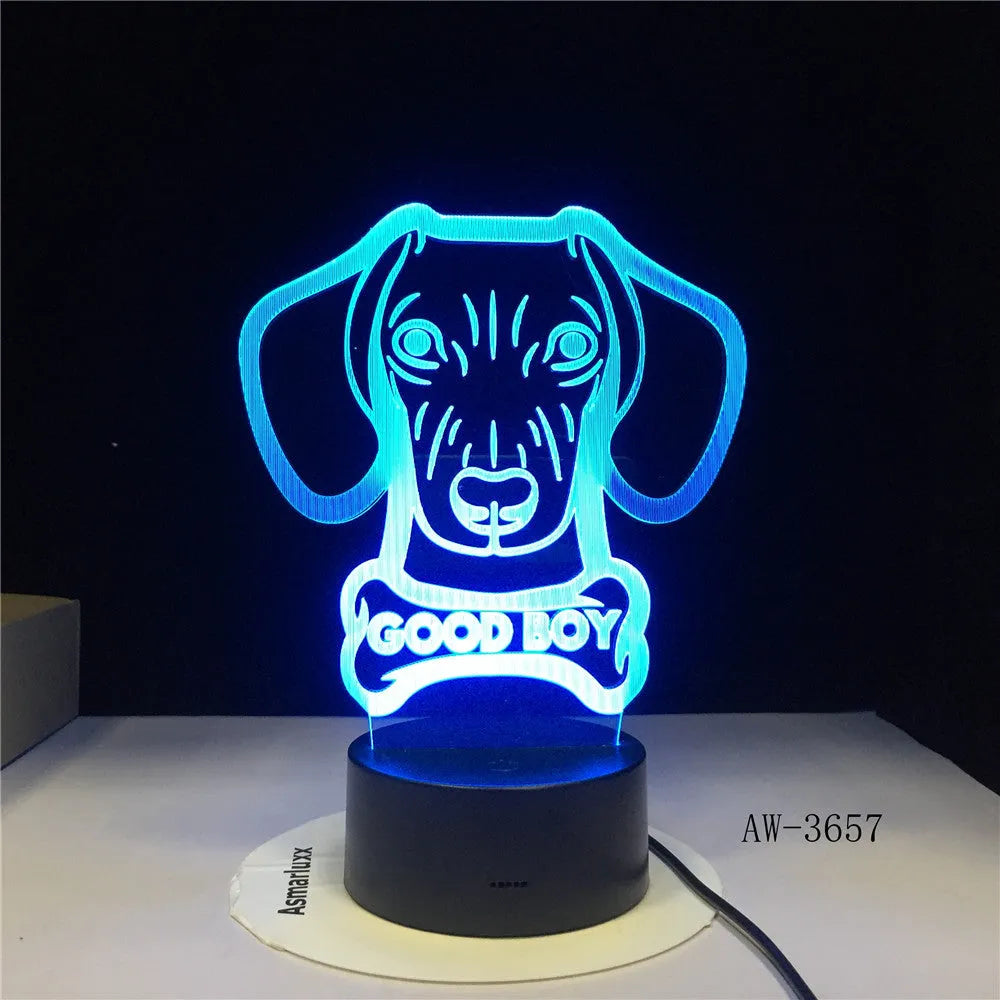 Black-based LED table lamp with a colourful gradient acrylic shade and remote control on a wooden surface.