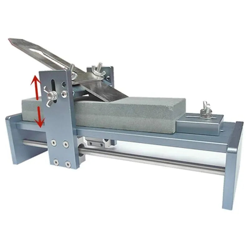Aluminium fixed angle sharpening tool for woodworking chisels and planer blades on a workbench.