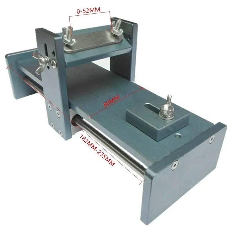 Aluminium fixed angle sharpening tool for woodworking chisels and planer blades on a workbench.