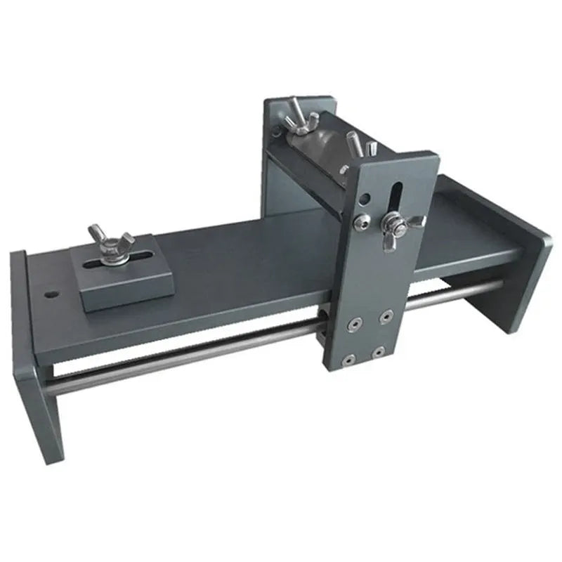 Aluminium fixed angle sharpening tool for woodworking chisels and planer blades on a workbench.
