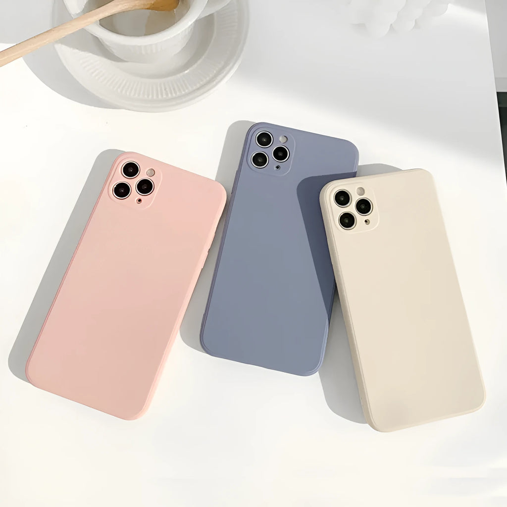 Simple solid colour silicone iPhone case in powder blue on a table.