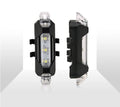 USB rechargeable red bicycle tail light with rubber buckle strap on a bike seat post