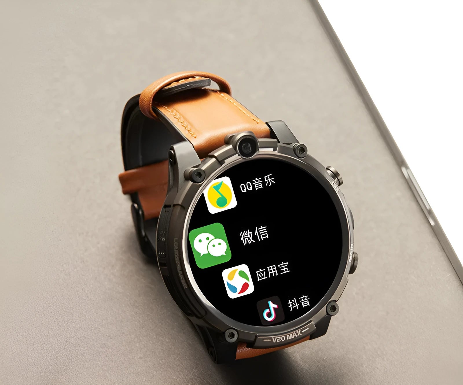 Black smart phone watch with 1.6-inch screen on a wrist strap, showing dual cameras and a heart rate sensor.