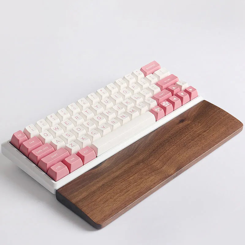 Walnut wood mechanical keyboard wrist rest showing natural wood grain and ergonomic design